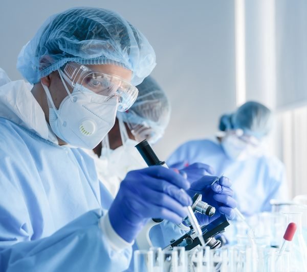 Scientists in a biochemical lab